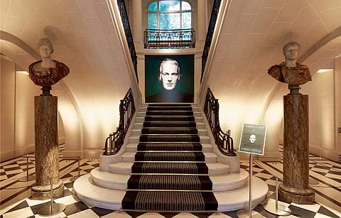 At Christie’s in Paris, the ‘Staircase of Honour’ for M. de Givenchy, with two Roman busts on either side of the grand staircase, and a black and white photo of the couturier by Robert Doisneau gracing the centre.