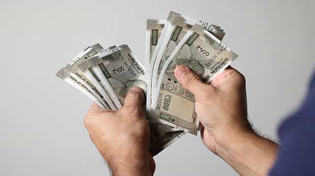 Rupee falls to record low of 82.69 against US dollar