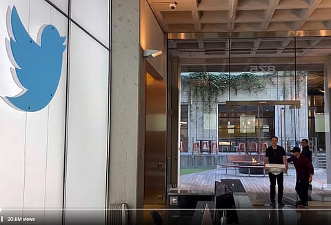 Tesla chief executive Elon Musk entering Twitter HQ carrying a porcelain sink.