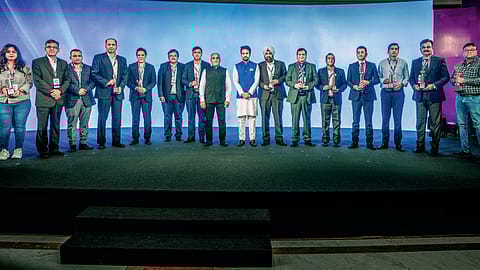 STAR-STUDDED: Chief guest and union minister for information & broadcasting and youth affairs & sports, Anurag Singh Thakur, with the winners of the Fortune India The Next 500 awards in New Delhi.