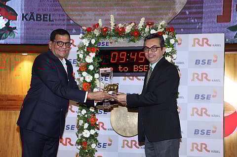 Left to Right: Shreegopal Kabra, Promoter & MD, R R Kabel and Girish Joshi, Chief Listing and Trading Development, BSE ringing the BSE Bell to mark the listing. 