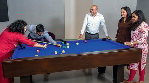 E. Balaji, CHRO, TVS SCS, with employees at the company’s Chennai office; #7, TVS Supply Chain Solutions