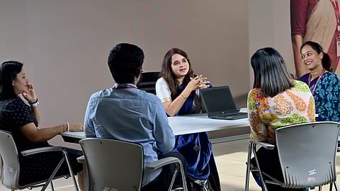 Rajkamal Vempati, president and HR head, with Axis Bank employees; Future-ready Workplaces, Axis Bank, #1