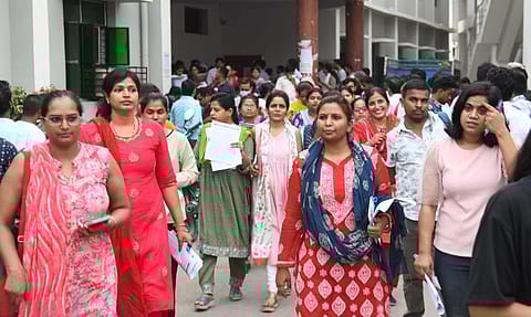 PATNA, INDIA - JUNE 18: Aspirants coming out from an examination centre after appeared in the UGC NET exams at A.N. College on June 18, 2024 in Patna, India.