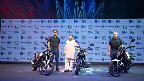 Bajaj Auto managing director Rajiv Bajaj (left) with Union minister Nitin Gadkari at the launch of CNG motorcycle Freedom.