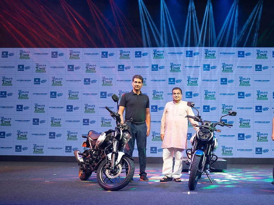 Bajaj Auto managing director Rajiv Bajaj (left) with Union minister Nitin Gadkari at the launch of CNG motorcycle Freedom.