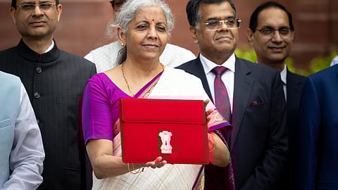 Finance Minister Nirmala Sitharaman (centre) with Budget tablet (Bahi Khata).