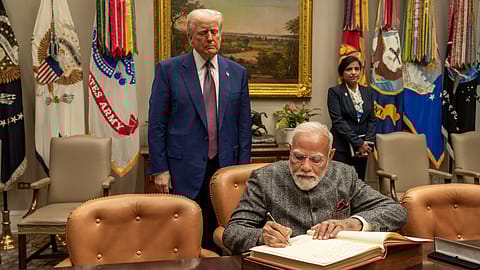 Prime Minister Narendra Modi (seated) with U.S. President Donald Trump.