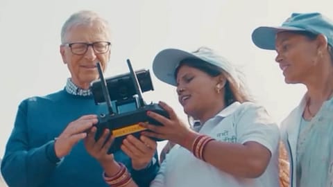 Former Microsoft CEO and philanthropist Bill Gates with a group of empowered women pilots known as "Drone Didis".