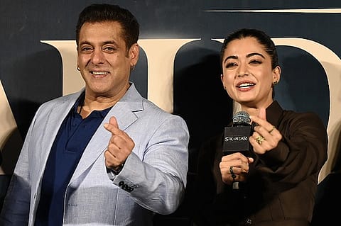 Bollywood actor Salman Khan with Rashmika Mandanna (R) at the trailer launch of Sikandar.