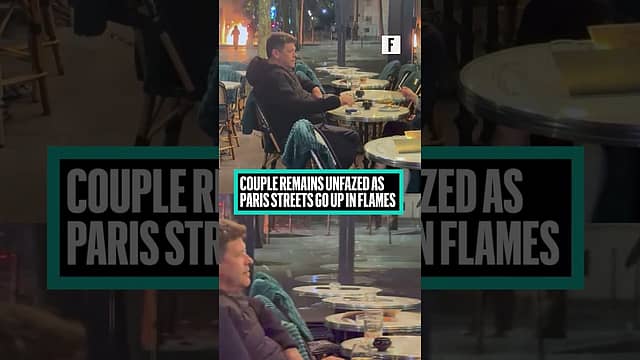Couple Remains Unfazed as Paris Streets Go Up in Flames