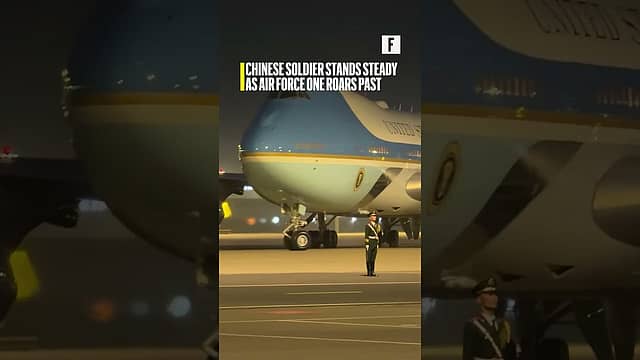 Chinese soldier stands steady as Air Force One roars past