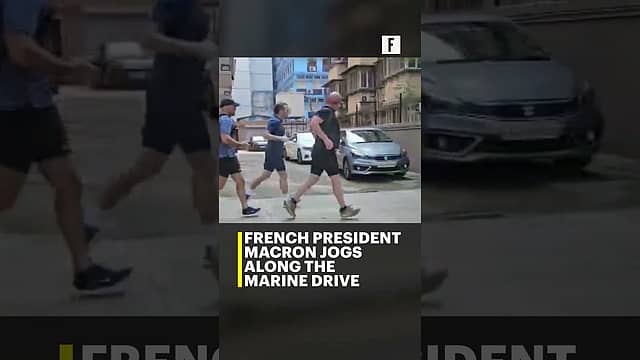 French President Macron jogs along the Marine Drive