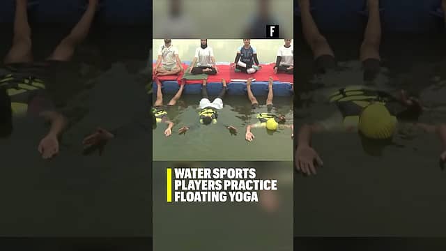 Water sports players practice floating yoga