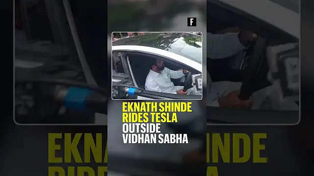 Eknath Shinde rides Tesla outside Vidhan Sabha
